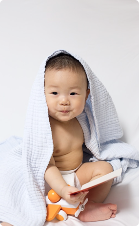 Baby holding a book
