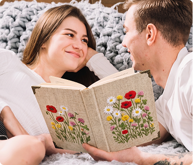 Couple looking at an embroidered book